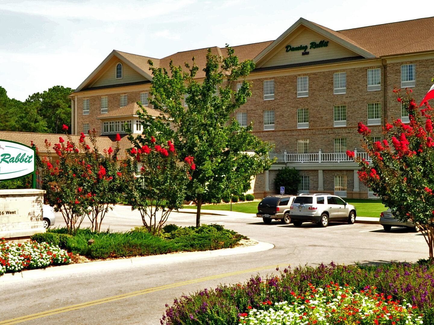 Exterior view of Dancing Rabbit Inn with garden near Pearl River Resorts