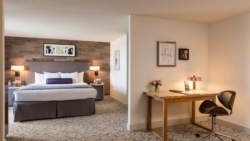 Working table with bed view in Executive Suite at Warwick Denver