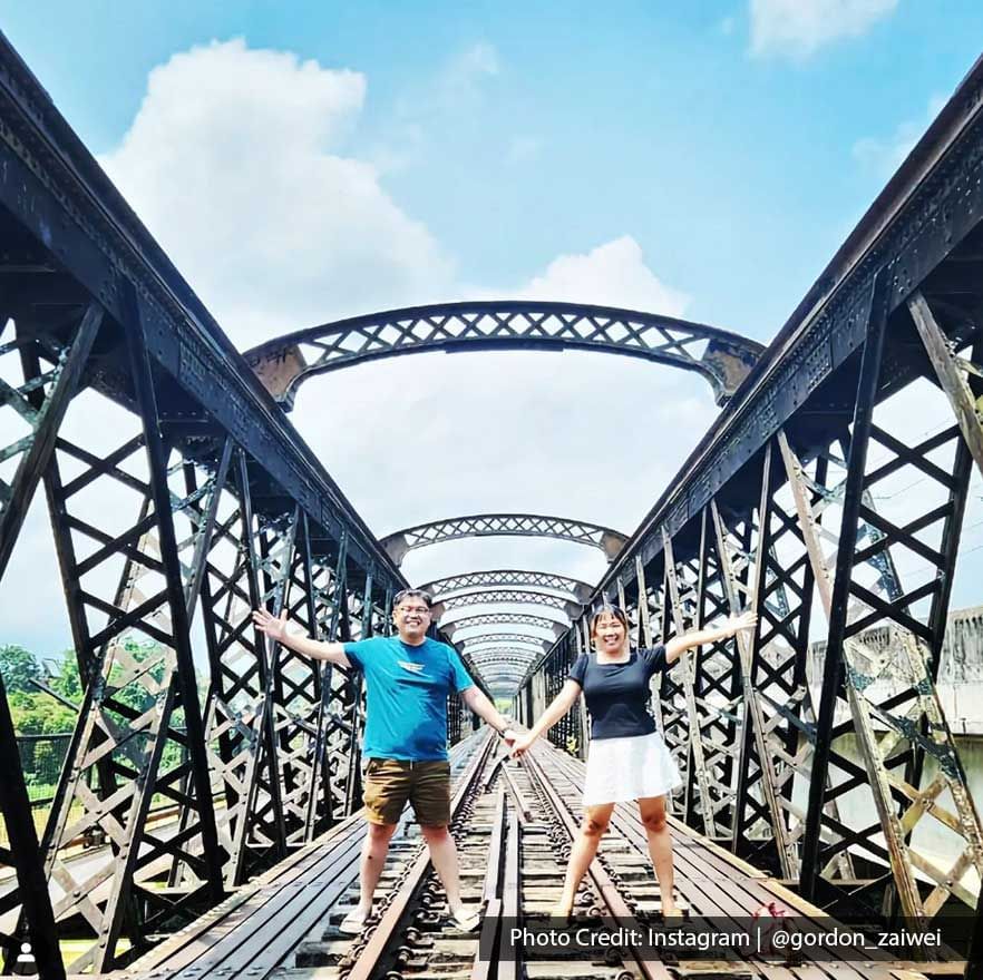 A couple were taking a picture on the Ipoh Victoria Bridge - Lexis Suites Penang