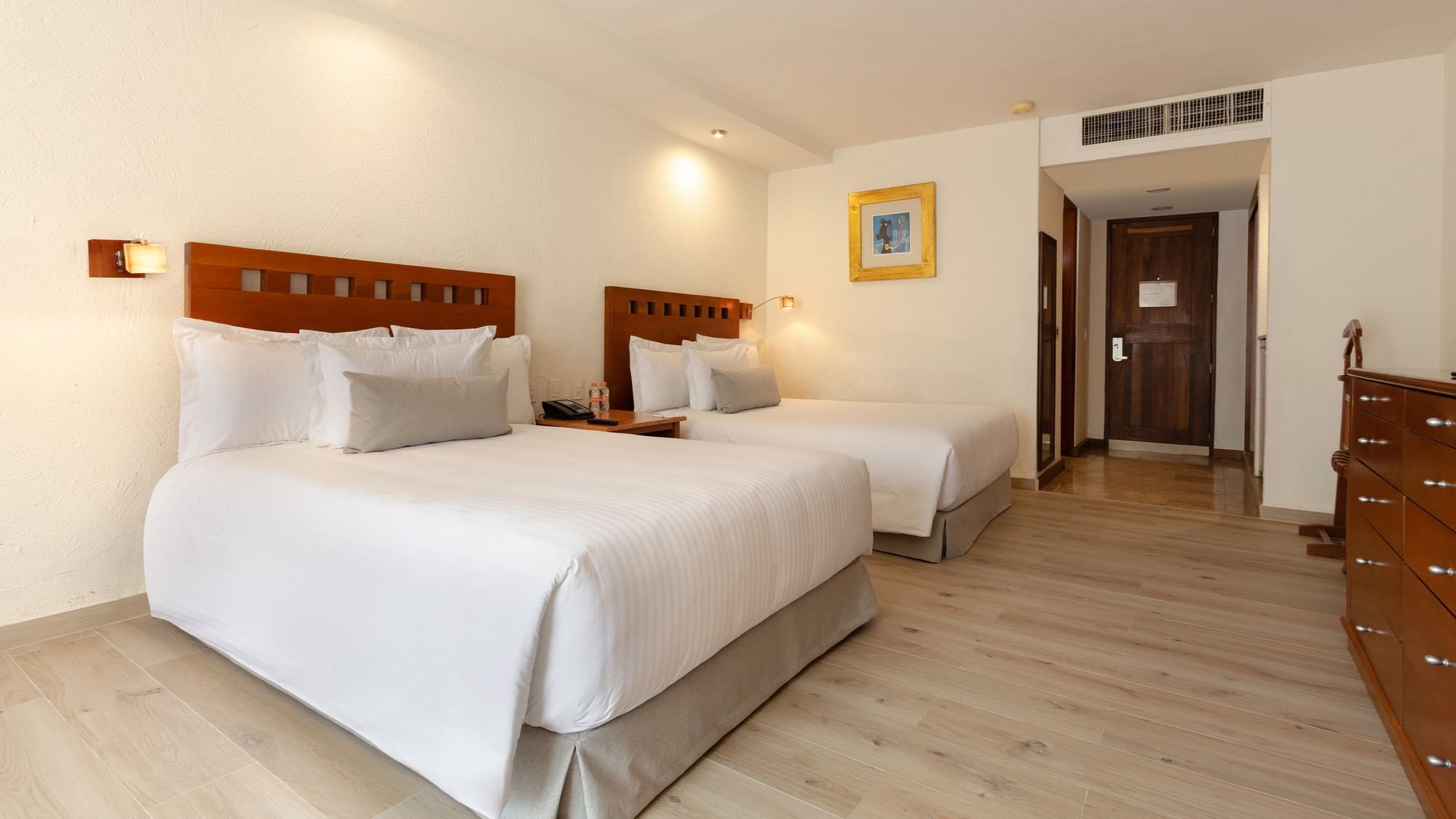 Two double beds in a Camino Real Club room at Camino Real Guadalajara in Zapopan