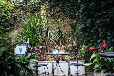 Outdoor bistro table with fresh breakfast at Chelsea Pines Inn in New York City