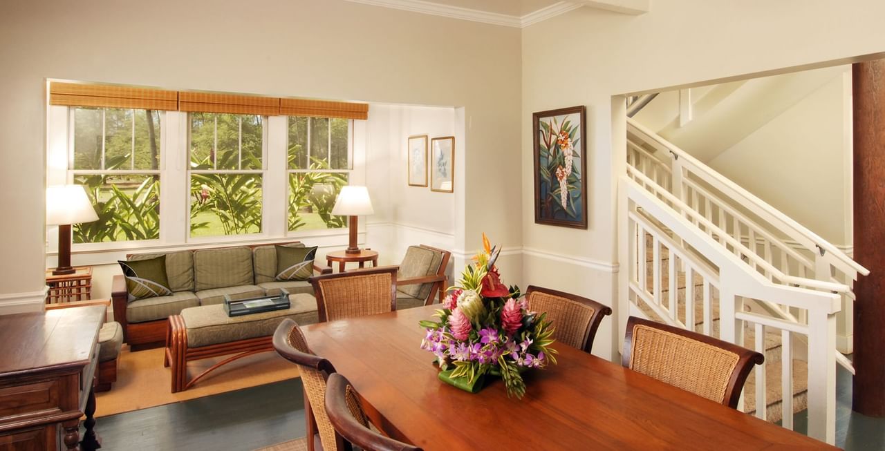 Dining room with table, chairs, a vase, and couch