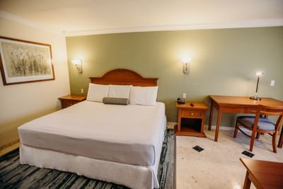Work desk and King bed in Junior Suite at Araiza Hotel Calafia