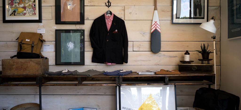 The inside of a store in Canmore with a selection of decorative items hung on the wall.