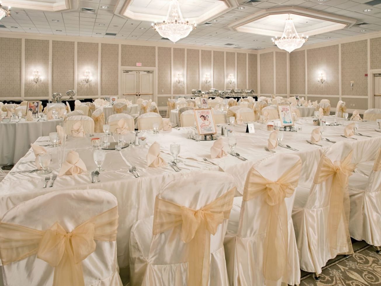 Decorated tables & chairs in a ballroom at Clayton Plaza Hotel