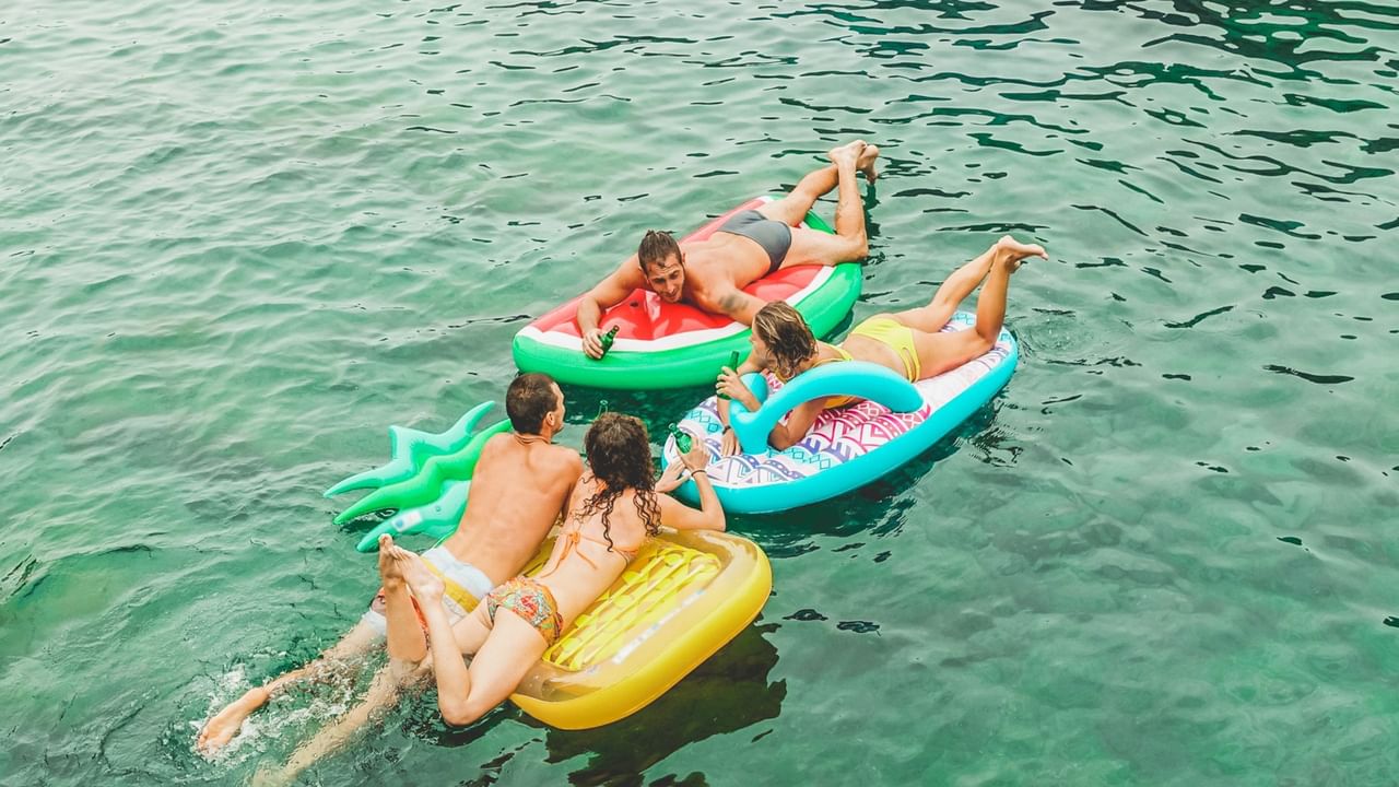 friends floating on river