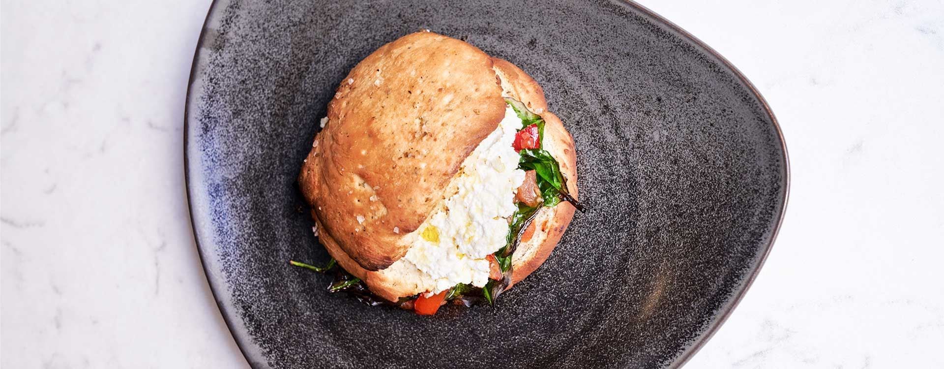 High-angle shot of a Lachs-burger served at Flemings Hotels