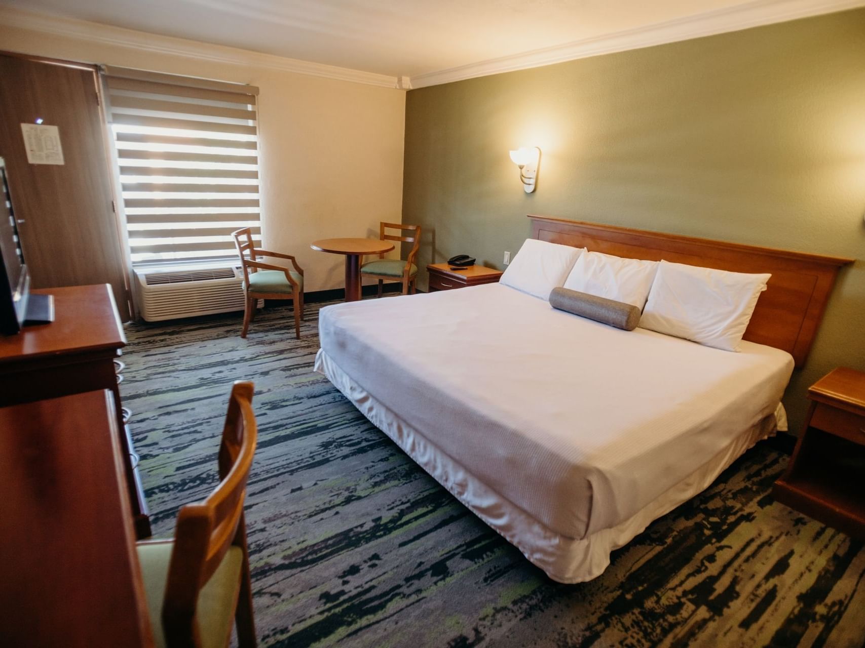 King bed and work desk in Standard room at Araiza Hotel Calafia