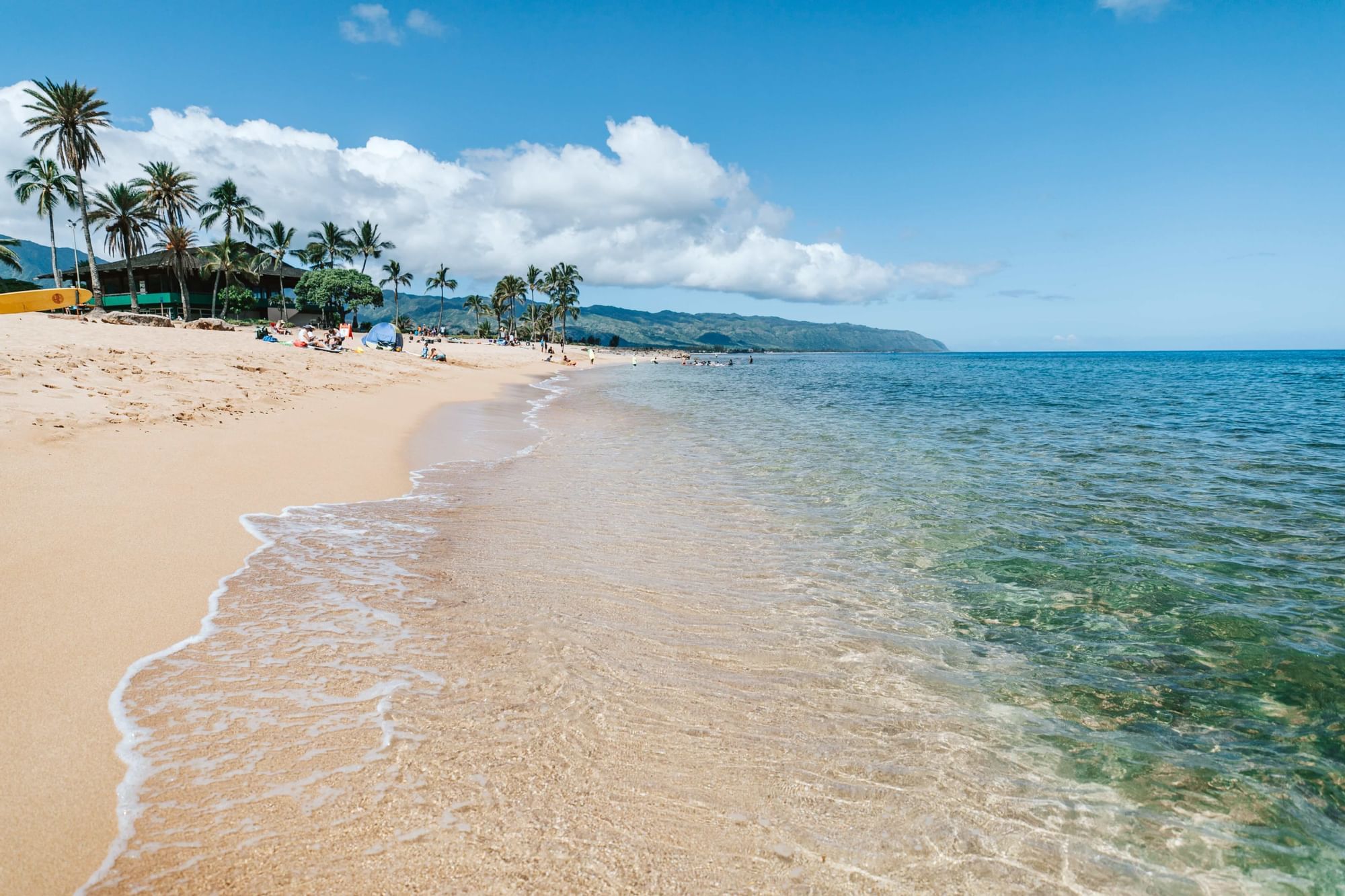 People enjoying on the Kailua Beach near Waikiki Resort Hotel