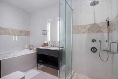 shower and bathtub with candles