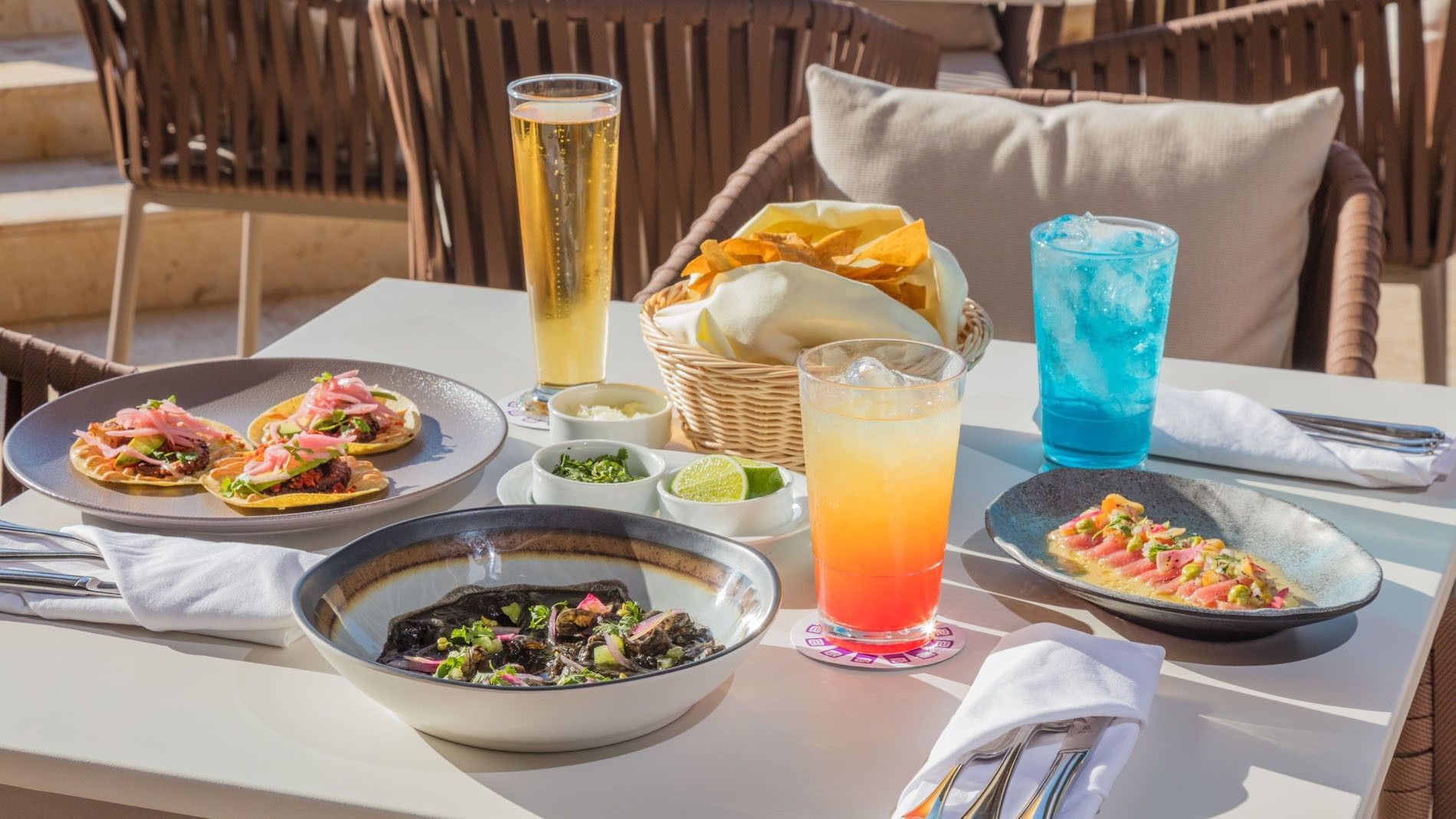 Gourmet tacos and colorful cocktails on a sunny terrace served in Blue Bar with fresh chips and salsa at Camino Real Merida