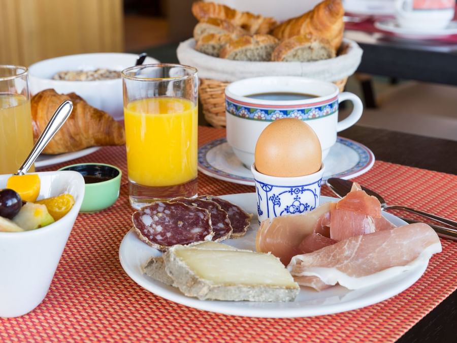 Breakfast plates on a table at Hotel Rey du Mont Sion