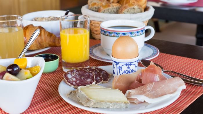 Breakfast plates on a table at Hotel Rey du Mont Sion