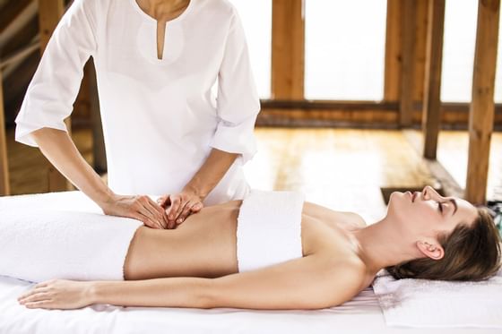 A young lady receiving a body massage at Liebes Rot's spa