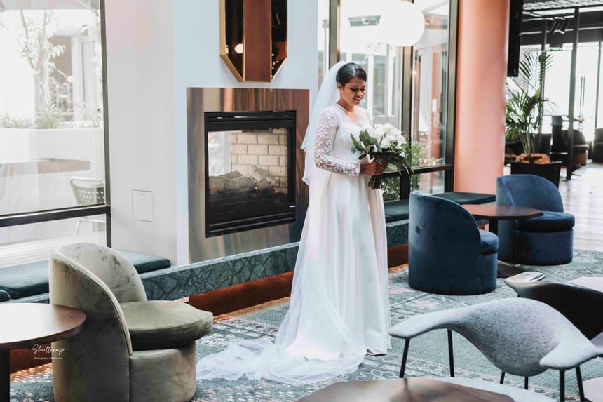 Bride Infront of the lobby fireplace at Amora Hotel Melbourne  