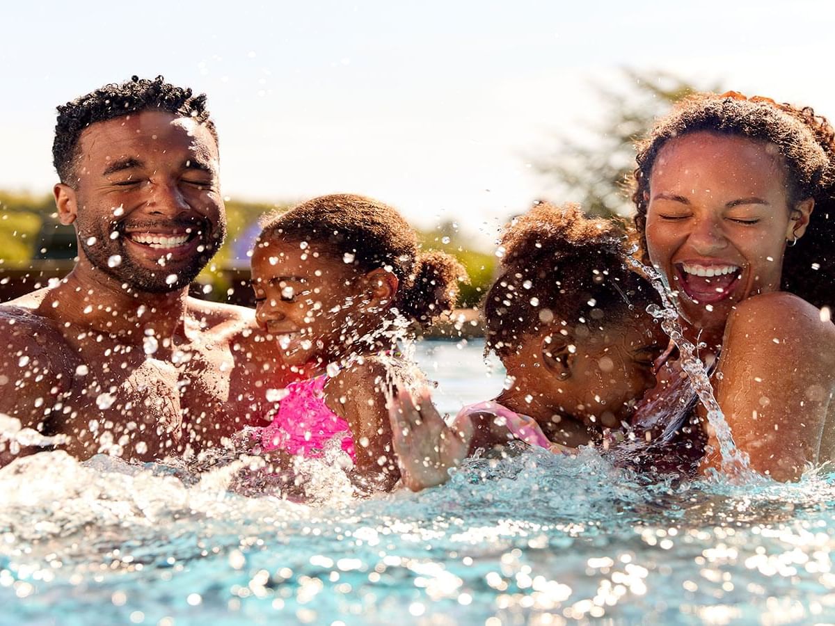 A family enjoying in the pool at Rosen Inn Universal