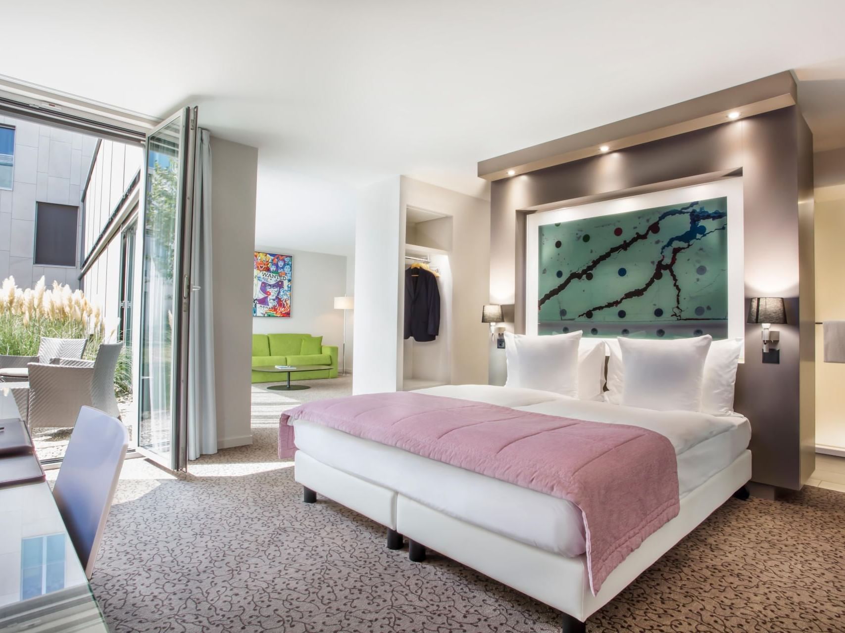 Bedroom with open windows overlooking the patio lounge at Starling Hotel Lausanne Switzerland hotel deals