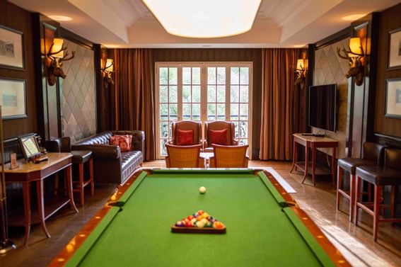 Pool table in the lounge area with a picture window at The Danna Langkawi