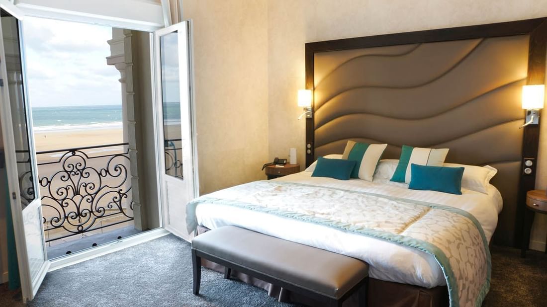 Double bed in Croisiere Salon Room with outdoor sea view at Le Grand Hôtel des Thermes