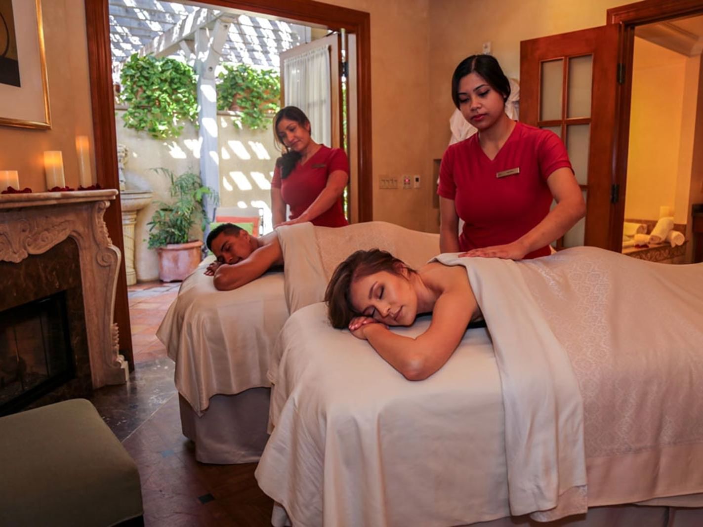 A couple getting massages at the Spa in Kelly's Spa & Boutique