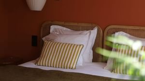 A comfy large bed in a Suite at The Originals Hotels