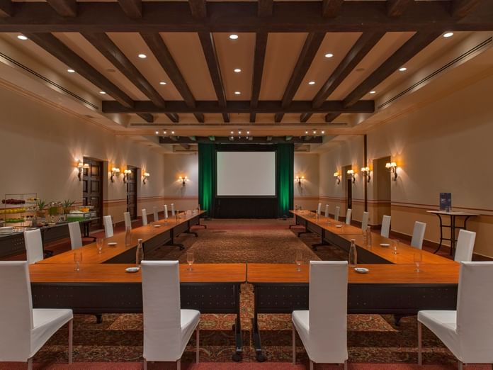 Arcos Room's U-shape table arrangements with comfortable seating at Hacienda del Mar Los Cabos