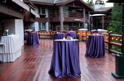 High tables on a terrace at a cocktail reception at Stein Lodge