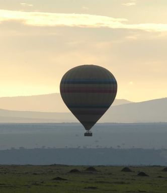 Hot Air Ballon Flying Near To Hills At Mara Serena Safari Lodge