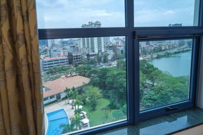 A Cityscape view through a room window at Hanoi Daewoo Hotel