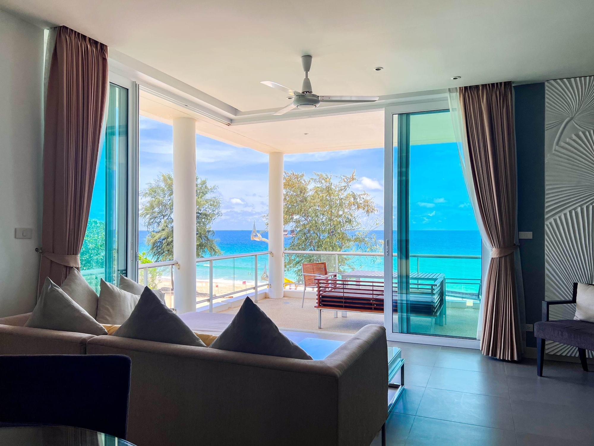 Living room with balcony and beautiful turquoise sea 