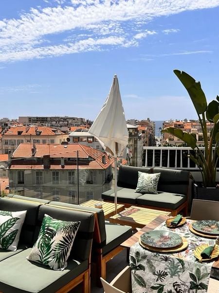 Bonobo’s Bar, featuring comfortable lounge seating and an expansive cityscape view at Splendid Hotel & Spa Nice