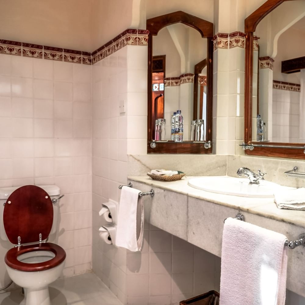 Bathroom with toilet and sink at Zanzibar Serena Hotel in Zanzibar.
