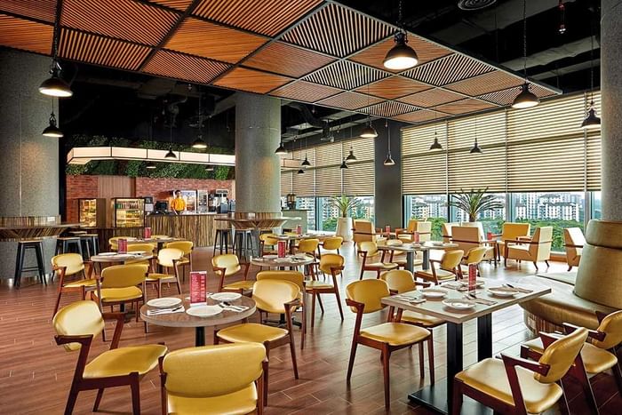 Dining table arrangement in restaurant area at Sunway Velocity Hotel
