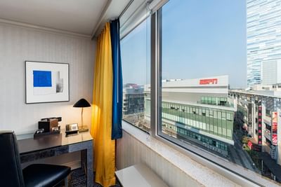 Desk by a window in Platinum Suite, E Central Downtown LA Hotel