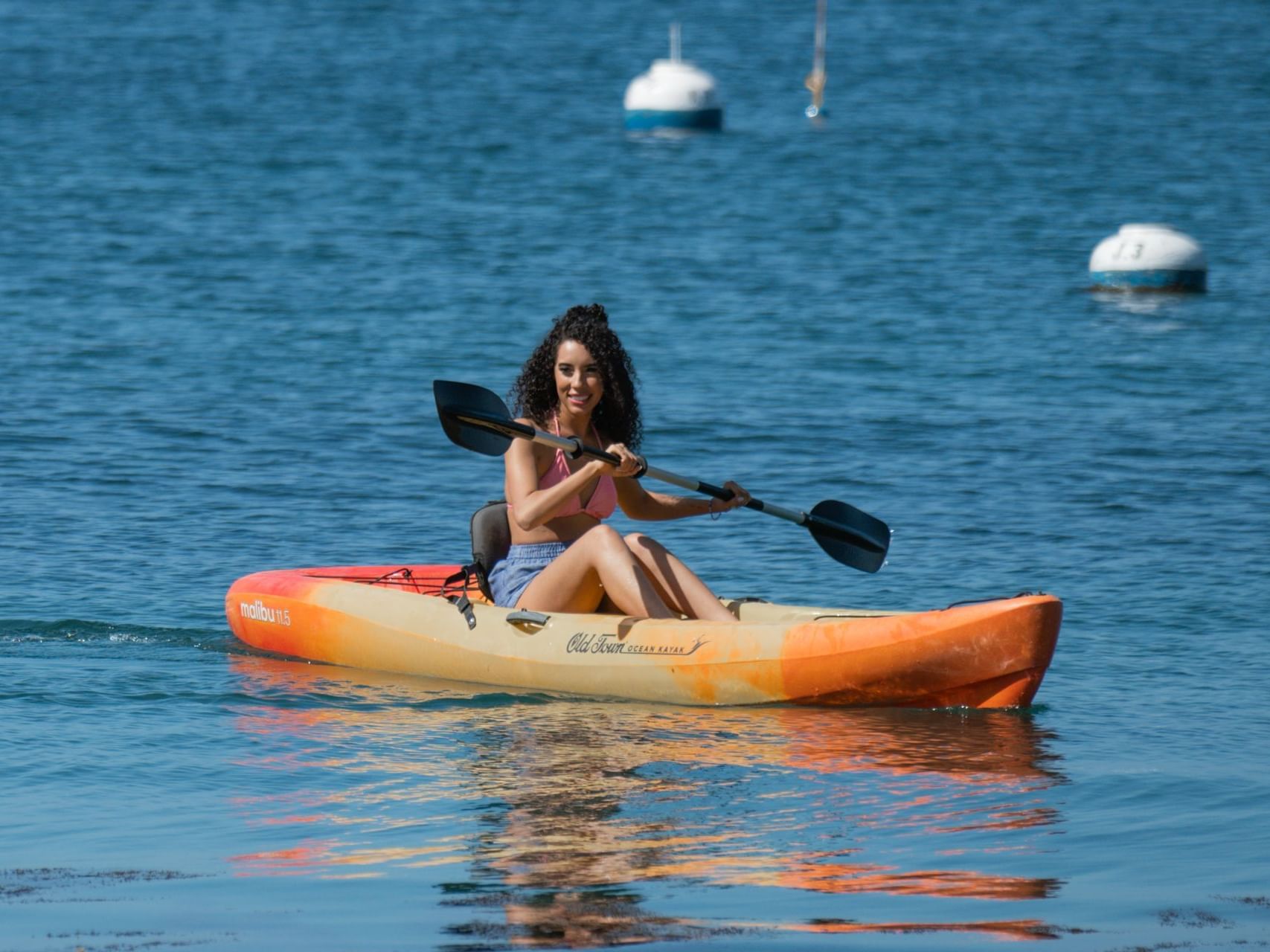 A lady kayaking at Descanso Beach near Catalina Island Company, one of the things to do in catalina island