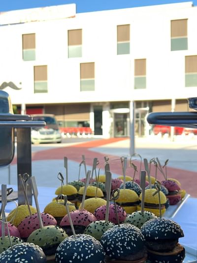 Mini burgers on display with skewers at Starling Hotels in Lausanne Switzerland