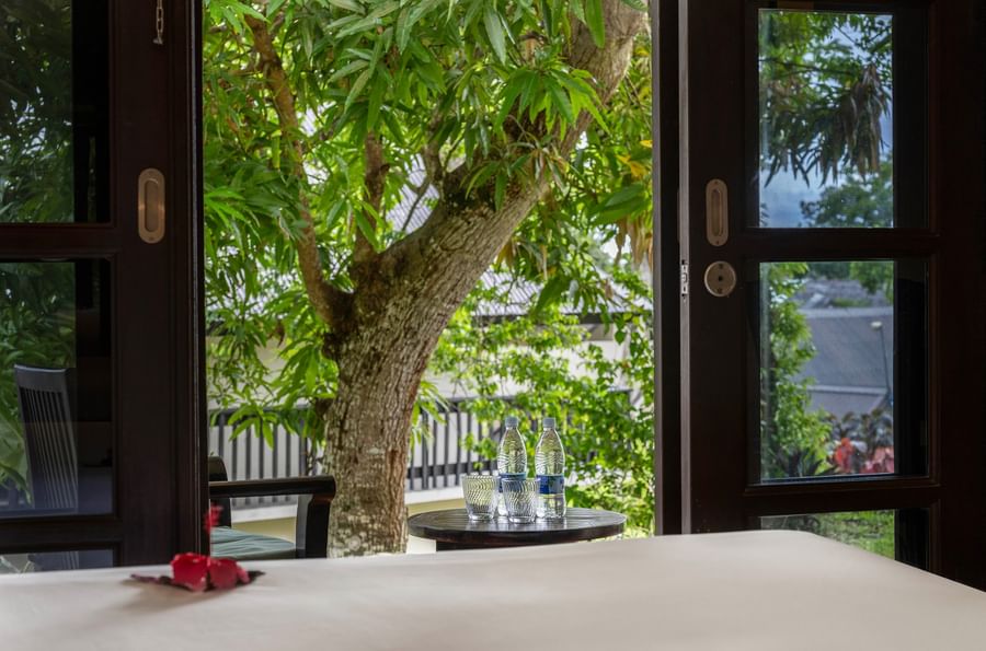View from hotel room with flowers and water bottles on table at Warwick Le Lagon - Vanuatu.