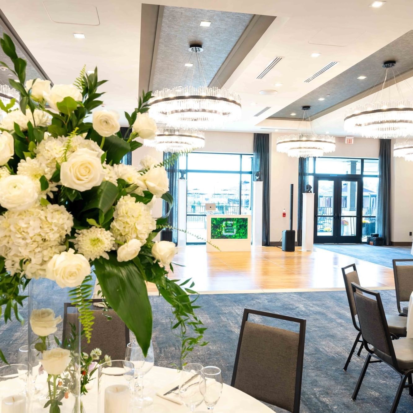 The Ballroom decorated with flowers and chandeliers at The Artisan Hotel at Tuscan Village