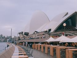 People walking around the Sydney Opera House near Amora Hotel