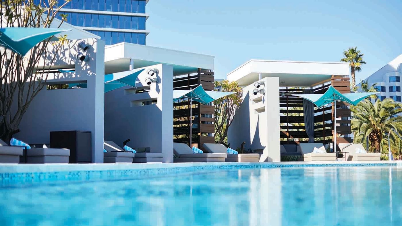 Pool with sun loungers at Crown Hotels