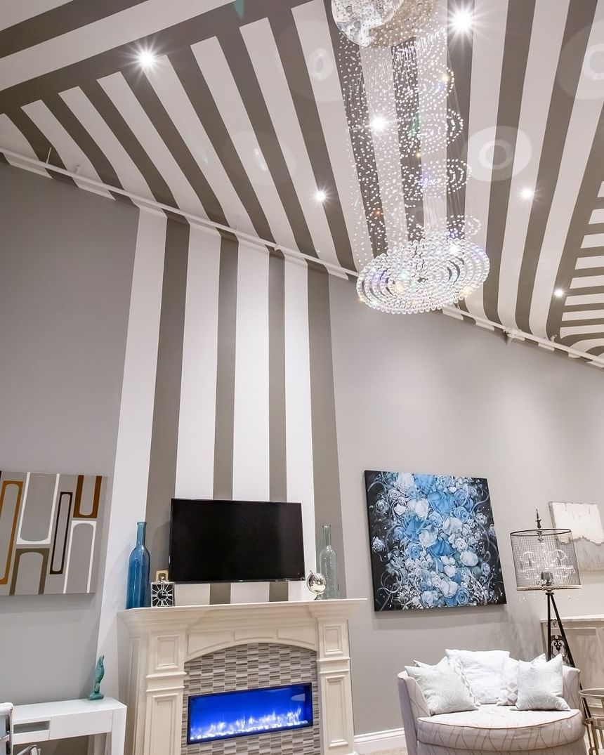 Swarovski crystal chandelier handing down from high ceiling with