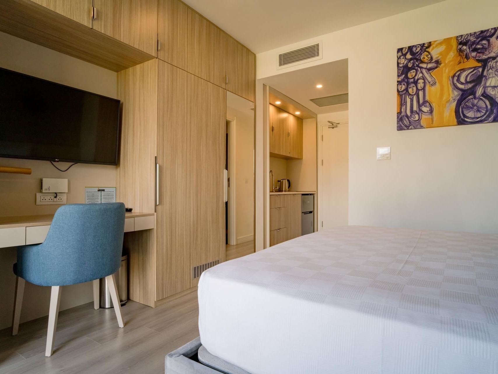 Bed with workspace and Kitchenette in Junior Suite at The Hub Acunmeyda