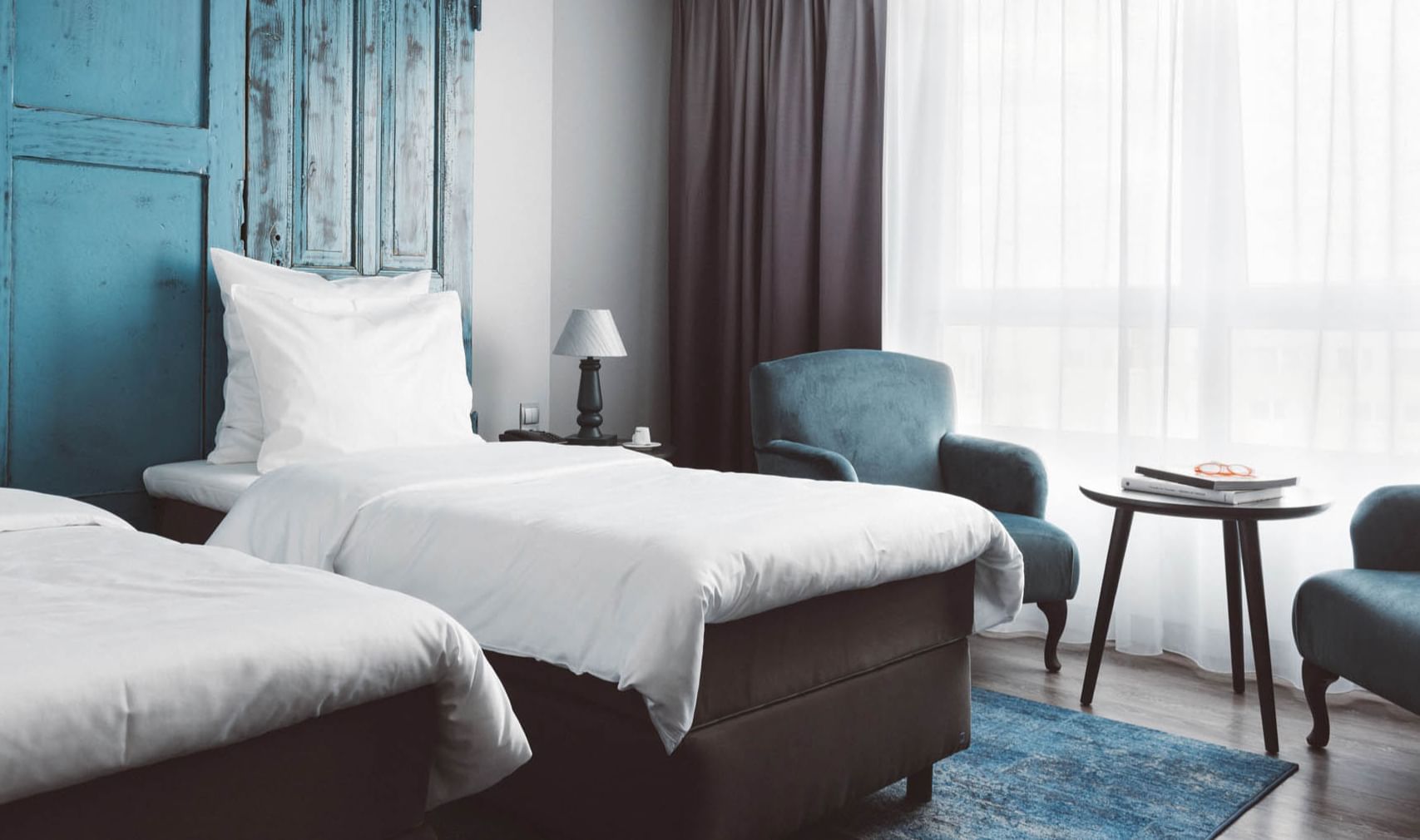 Two beds & window side sitting area at Hotel Berlin Berlin