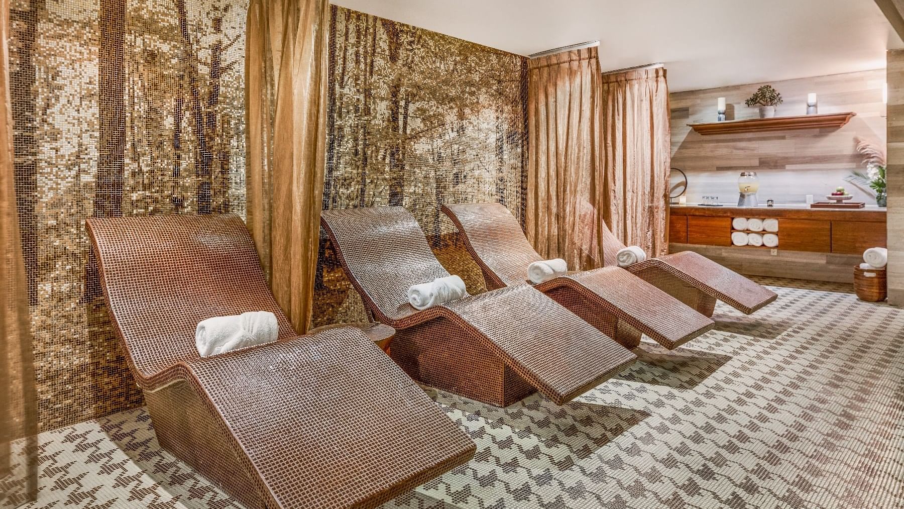 Spa room featuring wooden benches & vanity at Live Aqua Ciudad de México Bosques de las Lomas