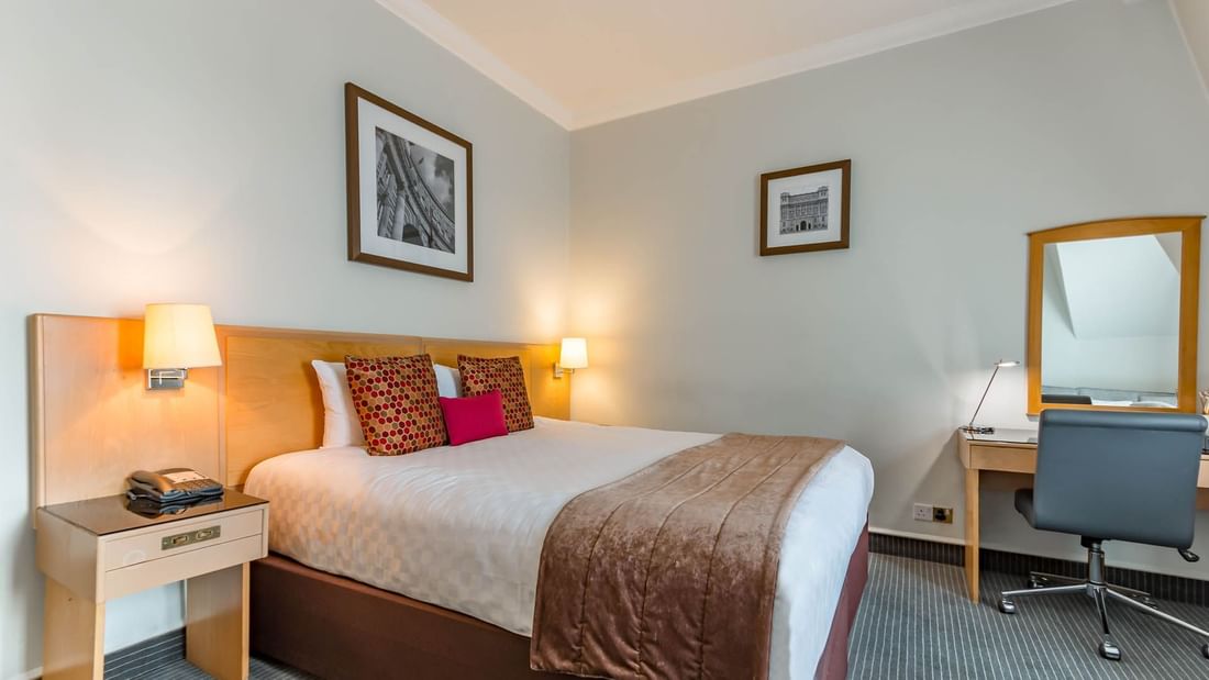 Bed & mirror in Family Room Sleeps 3 at Thistle Bloomsbury Park