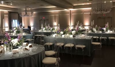 Dining table set-up in a wedding hall at Ethan Allen Hotel