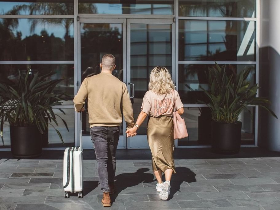 A couple at the entrance of the Hotel Angeleno