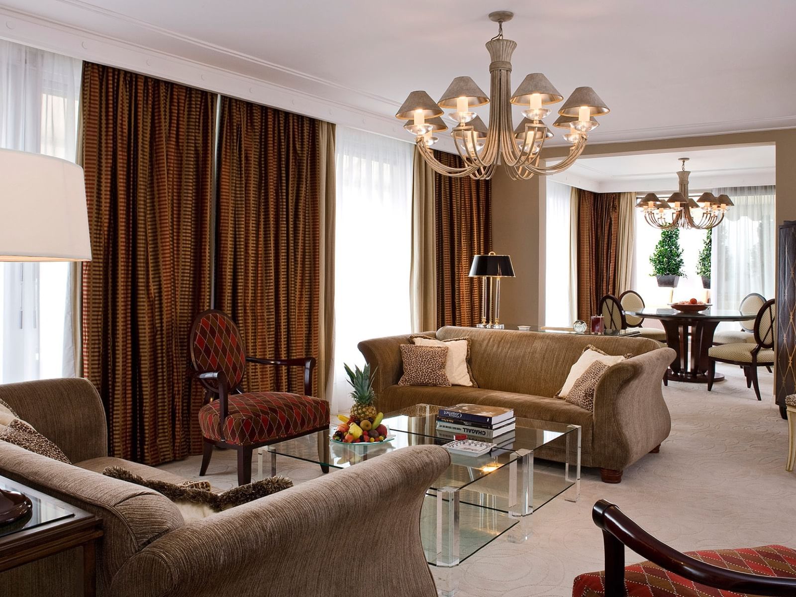 Presidential Suite Livingroom with sofas and dining area at Warwick Paris Champs Elysées