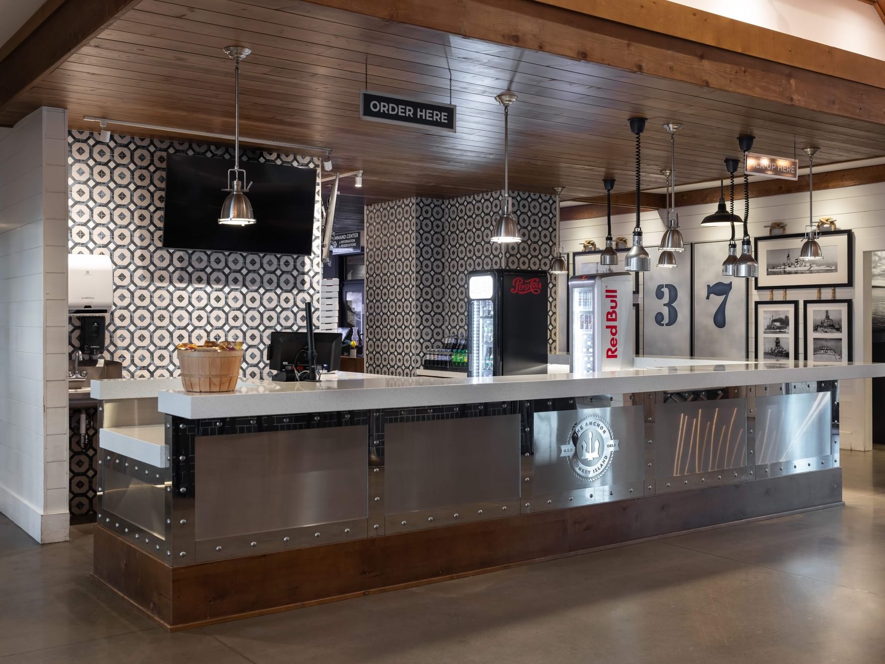 Modern counter with geometric design and Red Bull display at Anchor Crust Co. in Shangri-La Resort.