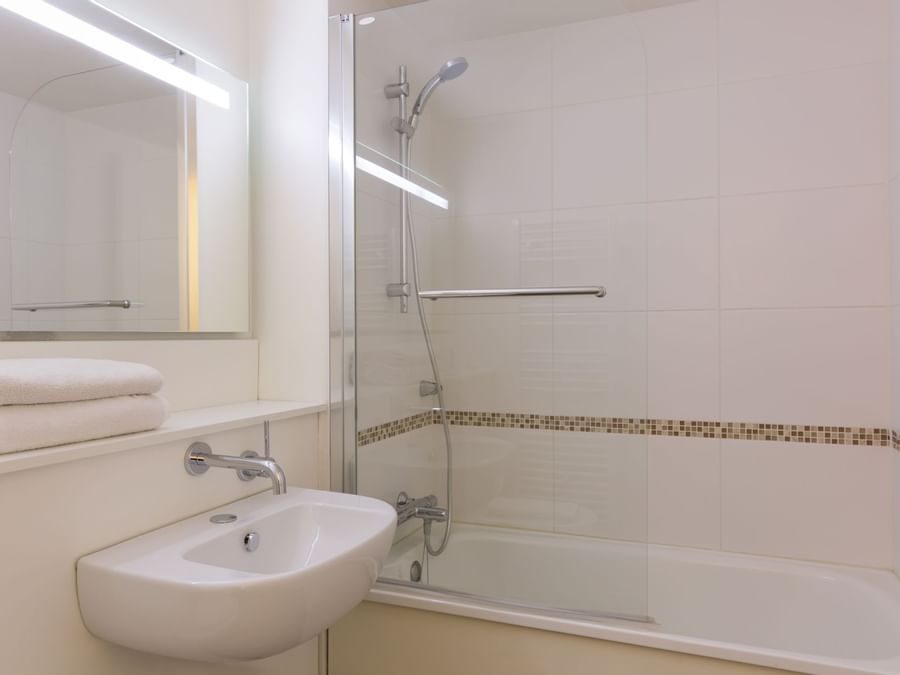 Bathroom vanity in bedrooms at Hotel Annecy Aeroport